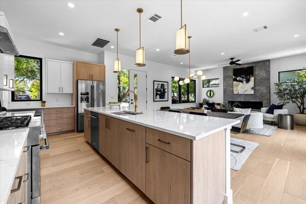 Fireplace, Interior, Kitchen, Living room, Pendant Lights, Recessed Lighting, Stainless Steel Appliances, Wood Texture Flooring