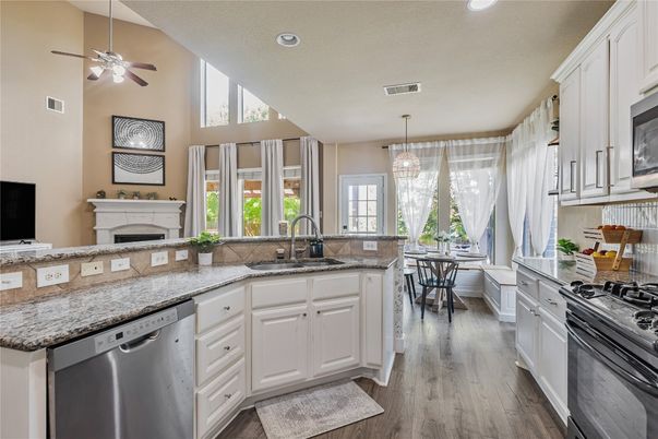 Dining room, Fireplace, Interior, Kitchen, Pendant Lights, Recessed Lighting, Wood Texture Flooring