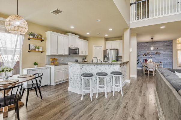 Dining room, Interior, Kitchen, Pendant Lights, Recessed Lighting, Stainless Steel Appliances, Stone Walls, Wood Texture Flooring