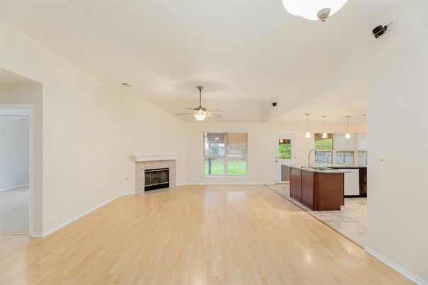Empty room, Fireplace, Interior, Kitchen, Pendant Lights, Wood Texture Flooring