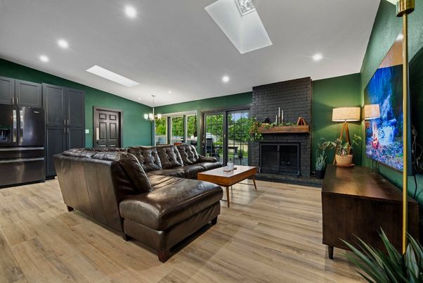 Chandelier, Fireplace, Interior, Living room, Pendant Lights, Recessed Lighting, Stone Walls, Wood Texture Flooring
