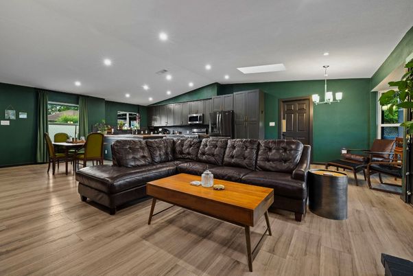 Chandelier, Dining room, Interior, Kitchen, Living room, Pendant Lights, Recessed Lighting, Stainless Steel Appliances, Wood Texture Flooring