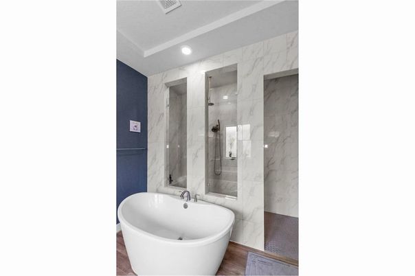 Bathroom, Free Standing Baths, Glass Shower, Interior, Marble Walls, Recessed Lighting