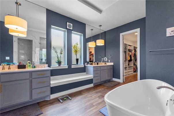 Bathroom, Dual Sink Vanities, Free Standing Baths, Interior, Pendant Lights, Recessed Lighting, Walk-in Closets, Wood Texture Flooring