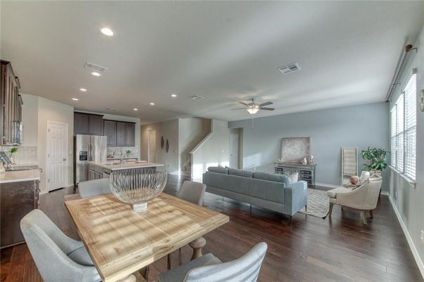 Dining room, Fireplace, Interior, Kitchen, Living room, Recessed Lighting, Stainless Steel Appliances, Wood Texture Flooring