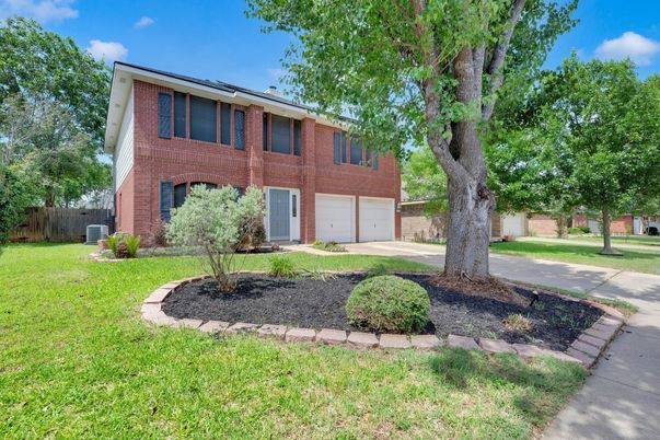 Attached, Backyard, Exterior, Facade, Brick Facade, Raised Ranch