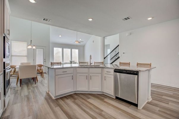Dining room, Interior, Kitchen, Pendant Lights, Recessed Lighting, Stainless Steel Appliances, Wood Texture Flooring