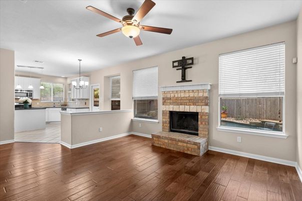 Empty room, Fireplace, Interior, Kitchen, Pendant Lights, Wood Texture Flooring