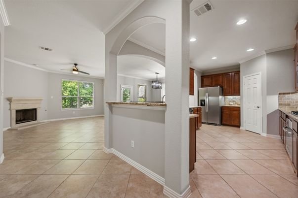 Chandelier, Fireplace, Interior, Kitchen, Pendant Lights, Recessed Lighting, Stainless Steel Appliances