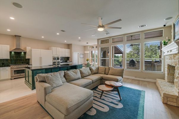 Fireplace, Interior, Kitchen, Living room, Recessed Lighting, Stainless Steel Appliances, Wood Texture Flooring
