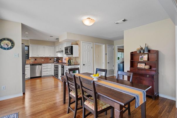 Dining room, Interior, Kitchen, Recessed Lighting, Stainless Steel Appliances, Wood Texture Flooring