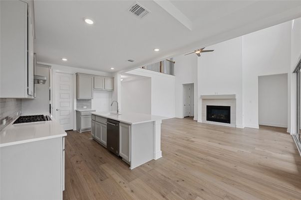 Fireplace, Interior, Kitchen, Recessed Lighting, Wood Texture Flooring