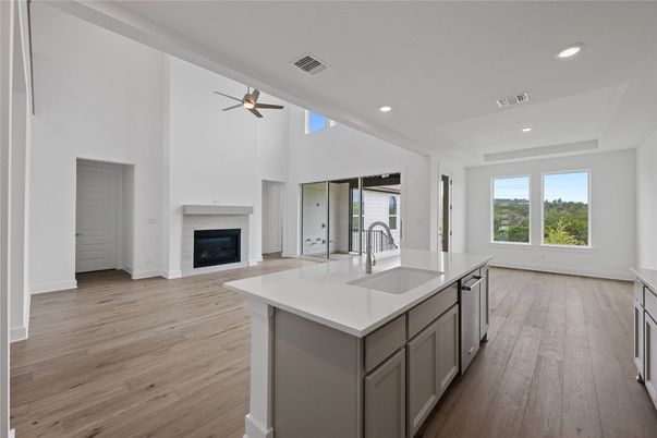 Empty room, Fireplace, Interior, Kitchen, Recessed Lighting, Wood Texture Flooring