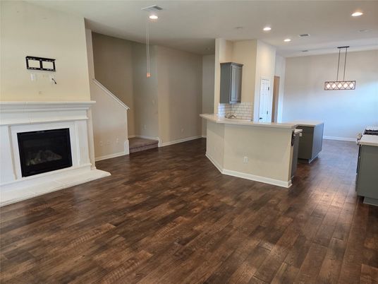 Empty room, Fireplace, Interior, Kitchen, Pendant Lights, Recessed Lighting, Wood Texture Flooring