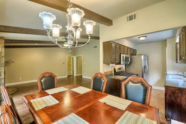 Chandelier, Dining room, Interior, Kitchen, Stainless Steel Appliances, Wooden Beams, Wood Texture Flooring