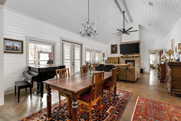 Chandelier, Dining room, Fireplace, Interior, Living room, Pendant Lights, Piano, Wood Texture Flooring