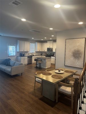 Dining room, Interior, Kitchen, Living room, Recessed Lighting, Stainless Steel Appliances, Wood Texture Flooring