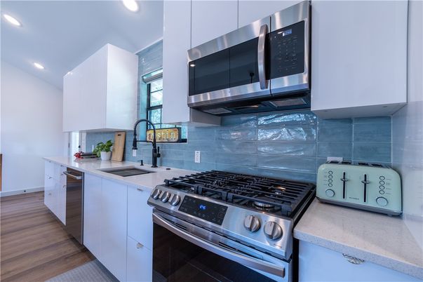 Interior, Kitchen, Recessed Lighting, Stainless Steel Appliances, Wood Texture Flooring