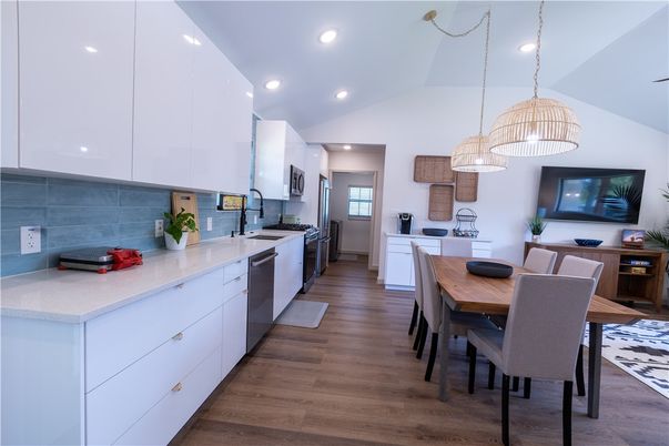 Dining room, Interior, Kitchen, Pendant Lights, Recessed Lighting, Stainless Steel Appliances, Wood Texture Flooring