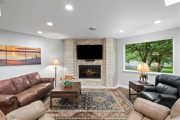 Fireplace, Interior, Living room, Recessed Lighting, Stone Walls, Wood Texture Flooring