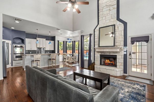 Dining room, Fireplace, Interior, Kitchen, Living room, Pendant Lights, Recessed Lighting, Stainless Steel Appliances, Stone Walls, Wood Texture Flooring