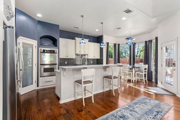 Dining room, Interior, Kitchen, Pendant Lights, Recessed Lighting, Stainless Steel Appliances, Wood Texture Flooring