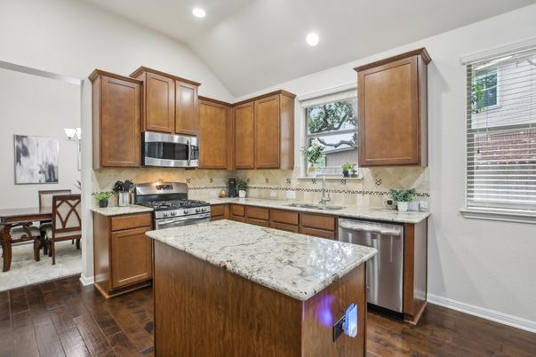 Dining room, Interior, Kitchen, Recessed Lighting, Stainless Steel Appliances, Wood Texture Flooring