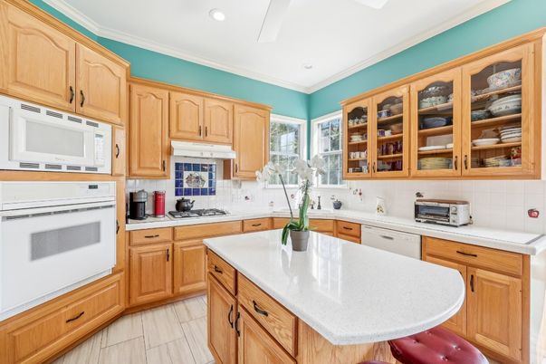 Interior, Kitchen, Recessed Lighting, Tile Countertops, Wood Texture Flooring