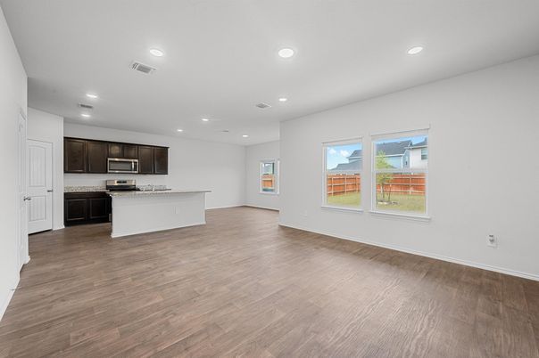Empty room, Interior, Kitchen, Recessed Lighting, Stainless Steel Appliances, Wood Texture Flooring