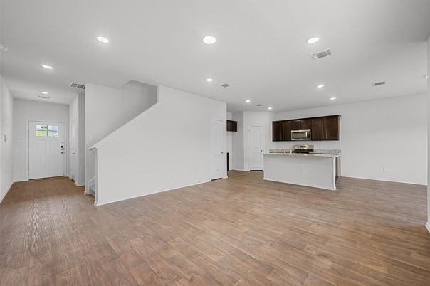 Empty room, Interior, Kitchen, Recessed Lighting, Stainless Steel Appliances, Wood Texture Flooring