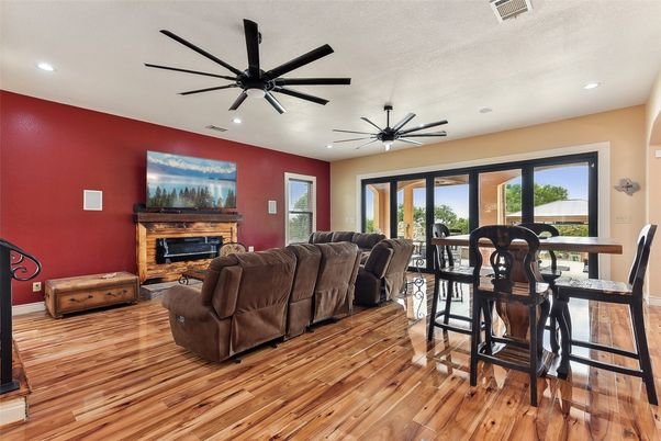Dining room, Fireplace, Interior, Living room, Recessed Lighting, Wood Texture Flooring