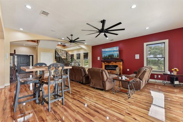 Dining room, Fireplace, Interior, Living room, Recessed Lighting, Wood Texture Flooring