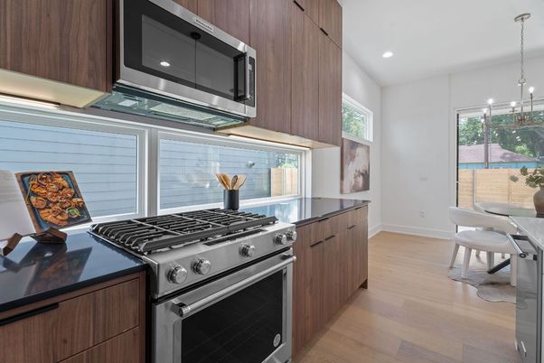 Dining room, Interior, Kitchen, Pendant Lights, Recessed Lighting, Stainless Steel Appliances, Wood Texture Flooring