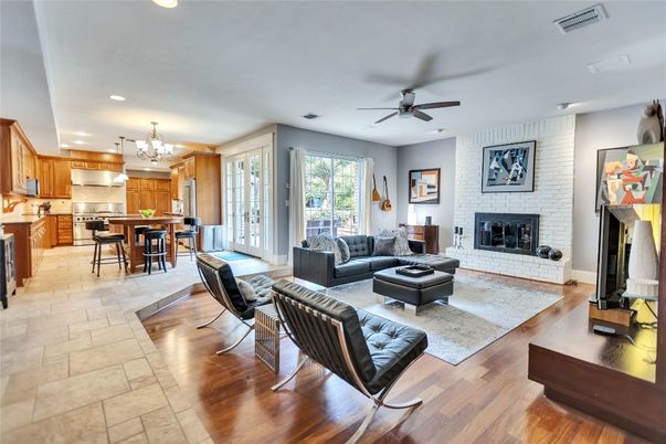 Chandelier, Dining room, Fireplace, Interior, Kitchen, Living room, Recessed Lighting, Stone Walls, Wood Texture Flooring