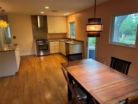 Dining room, Interior, Kitchen, Pendant Lights, Recessed Lighting, Stainless Steel Appliances, Wood Texture Flooring