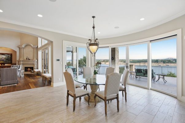 Dining room, Fireplace, Interior, Pendant Lights, Recessed Lighting, Water, Wood Texture Flooring