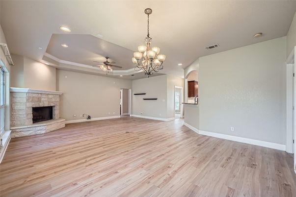 Chandelier, Empty room, Fireplace, Interior, Recessed Lighting, Wood Texture Flooring
