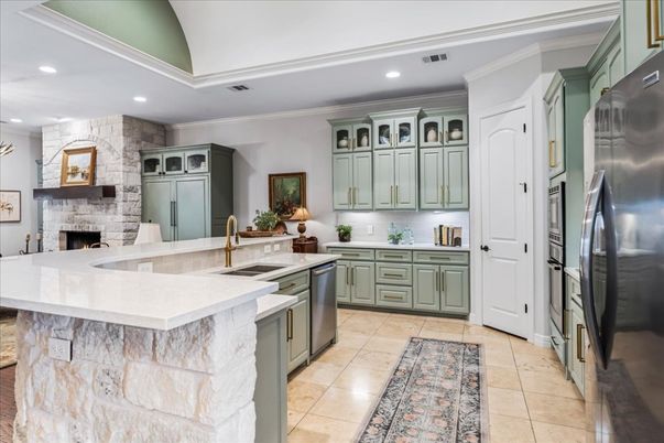 Fireplace, Interior, Kitchen, Recessed Lighting, Stainless Steel Appliances, Stone Walls