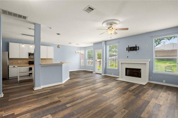 Empty room, Fireplace, Interior, Kitchen, Pendant Lights, Wood Texture Flooring