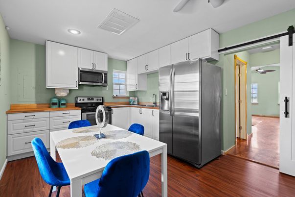 Dining room, Interior, Kitchen, Recessed Lighting, Stainless Steel Appliances, Wood Texture Flooring
