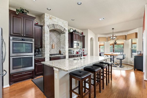 Dining room, Interior, Kitchen, Pendant Lights, Recessed Lighting, Stainless Steel Appliances, Wood Texture Flooring