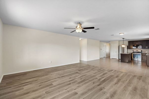 Empty room, Interior, Kitchen, Pendant Lights, Stainless Steel Appliances, Wood Texture Flooring