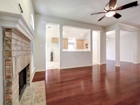 Empty room, Fireplace, Interior, Kitchen, Recessed Lighting, Stone Walls, Wood Texture Flooring