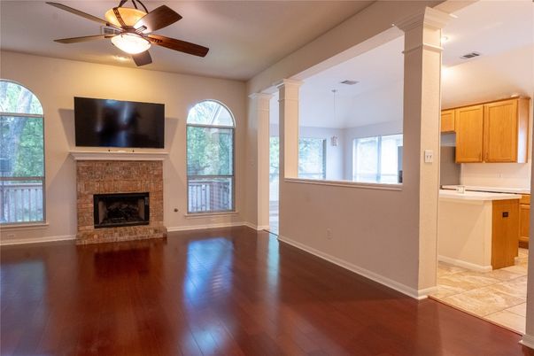 Empty room, Fireplace, Interior, Kitchen, Pendant Lights, Wood Texture Flooring