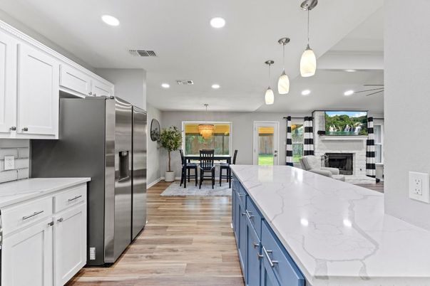 Dining room, Fireplace, Interior, Kitchen, Pendant Lights, Recessed Lighting, Stainless Steel Appliances, Wood Texture Flooring