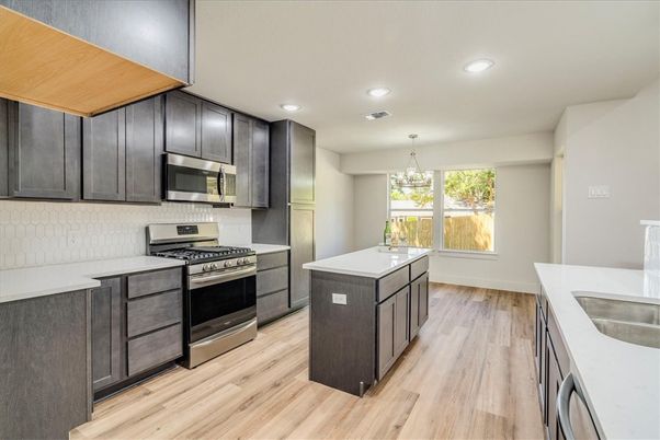 Chandelier, Interior, Kitchen, Recessed Lighting, Stainless Steel Appliances, Wood Texture Flooring