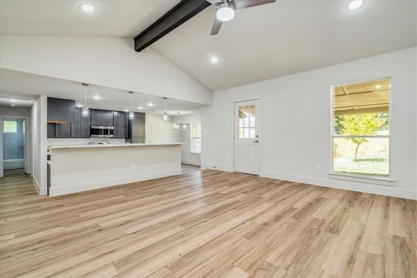 Empty room, Interior, Kitchen, Pendant Lights, Recessed Lighting, Stainless Steel Appliances, Wooden Beams, Wood Texture Flooring