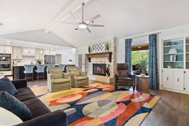 Fireplace, Interior, Kitchen, Living room, Pendant Lights, Recessed Lighting, Stainless Steel Appliances, Stone Walls, Wood Texture Flooring