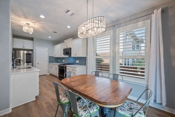 Dining room, Interior, Kitchen, Pendant Lights, Recessed Lighting, Stainless Steel Appliances, Wood Texture Flooring