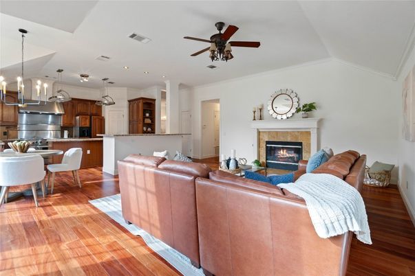 Dining room, Fireplace, Interior, Kitchen, Living room, Pendant Lights, Recessed Lighting, Stainless Steel Appliances, Wood Texture Flooring